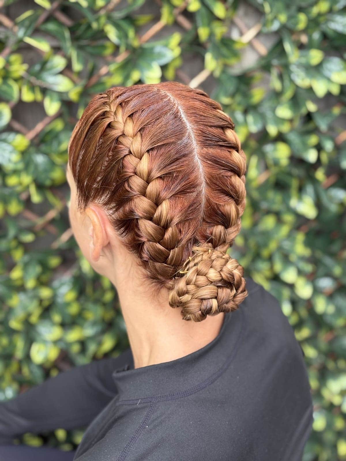 Two Dutch braids pinned into a bun