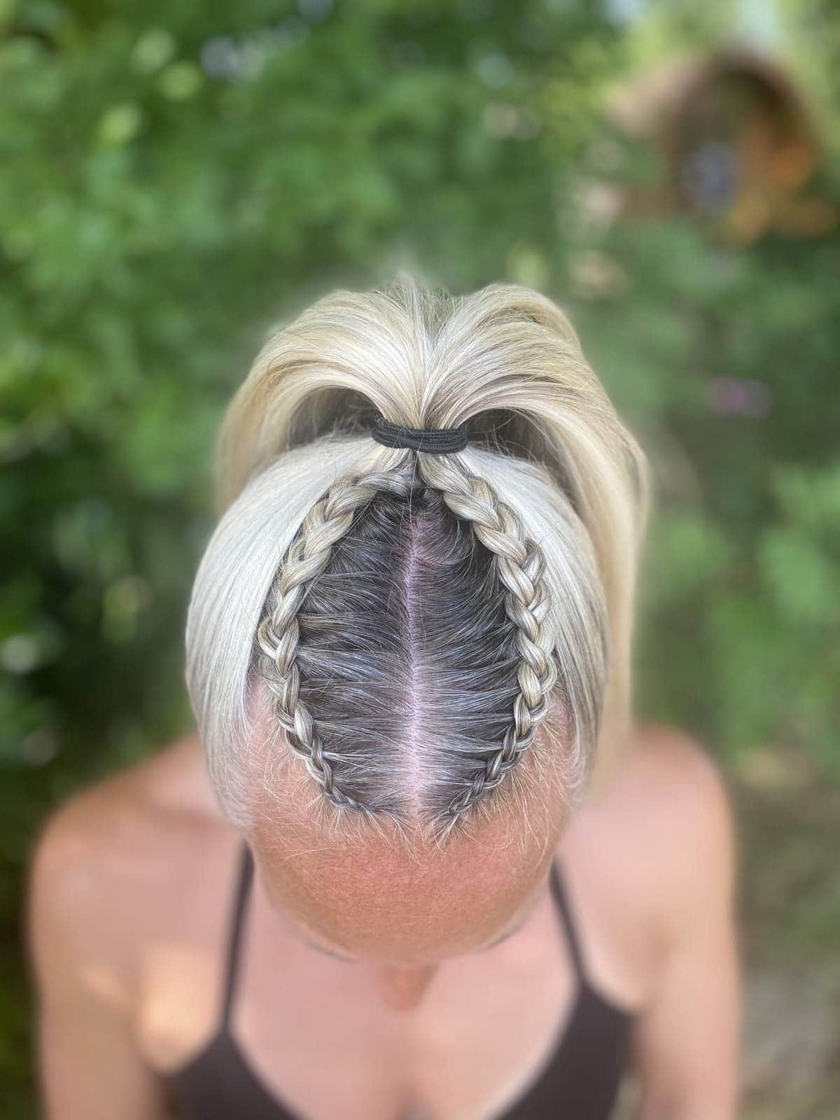 Two Dutch braids into a high ponytail